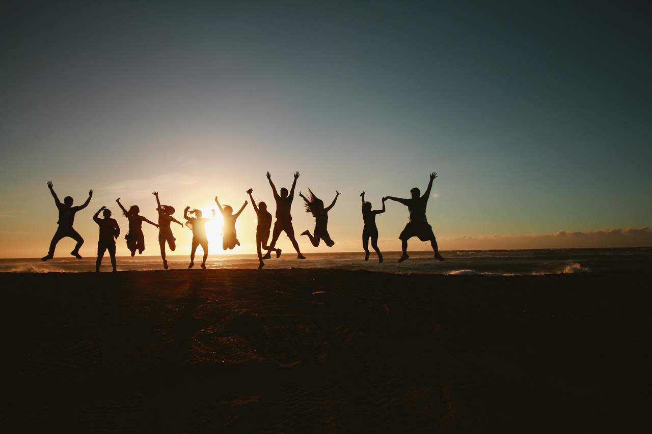 group of people jumping happily