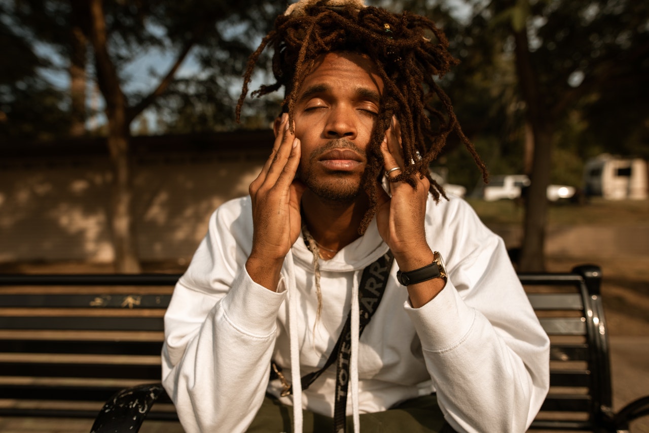 anxious man sitting on a bench