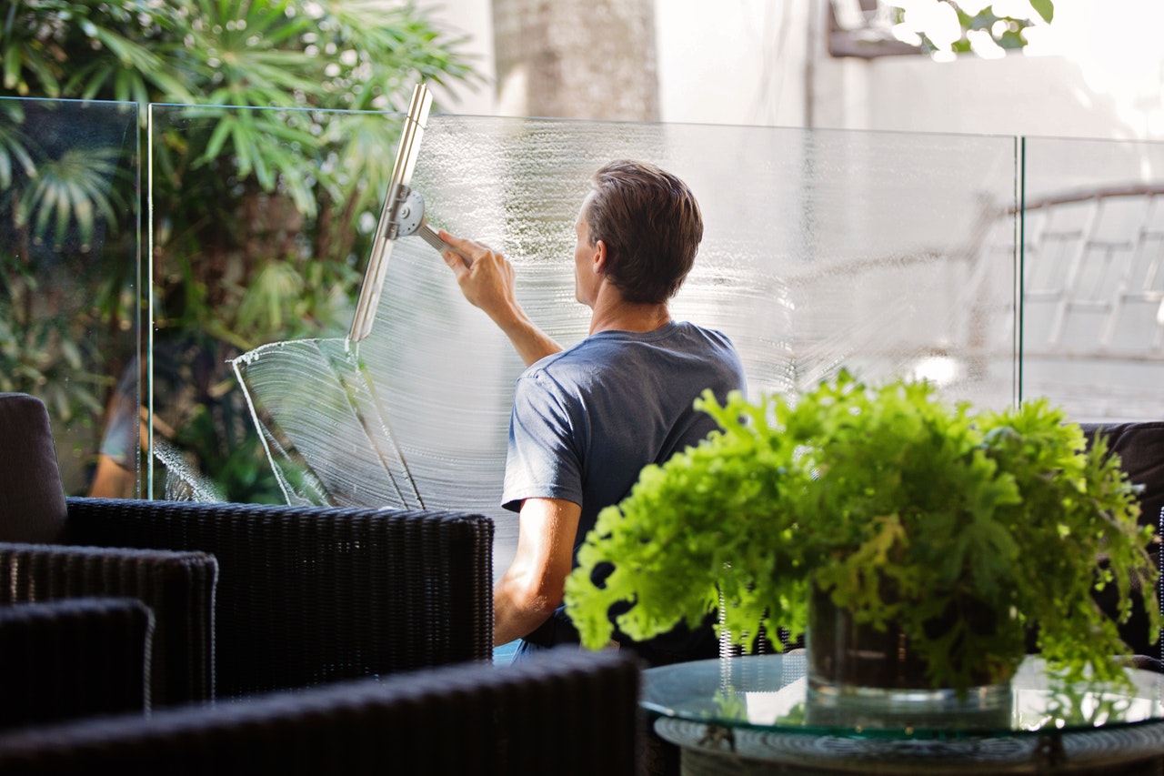 man cleaning windows