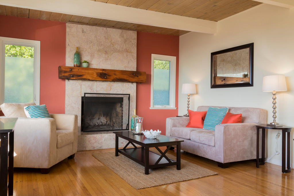 colorful living room with a fireplace on its center