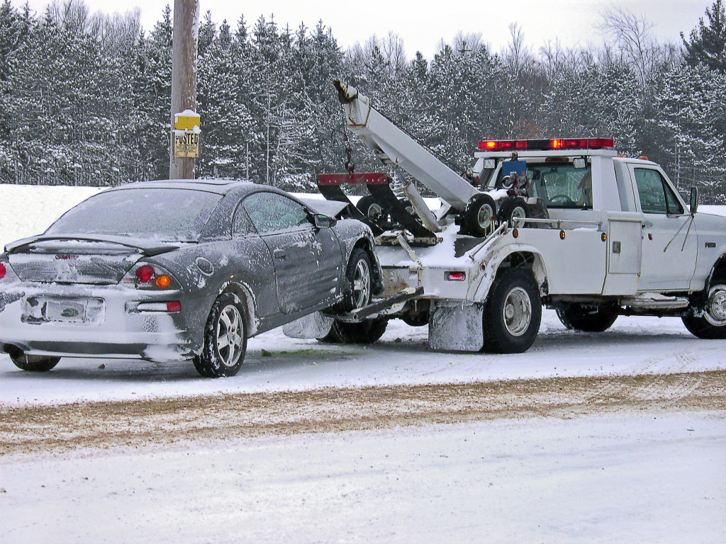 Car being towed due to icy roads