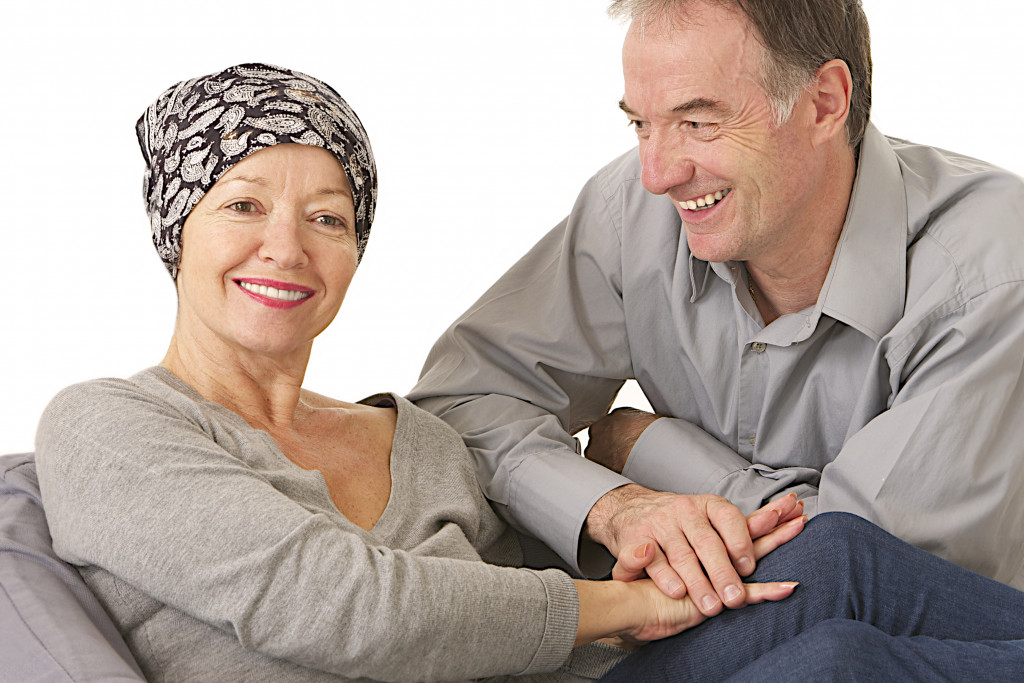 husband holsing hands with wife