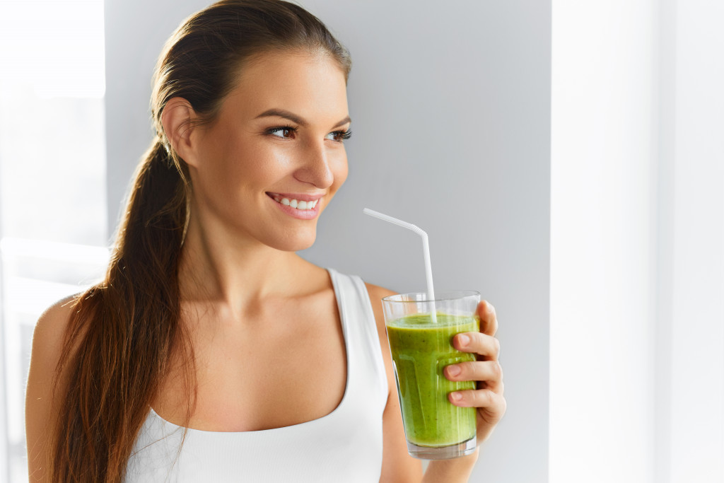woman drinking healthy beverage