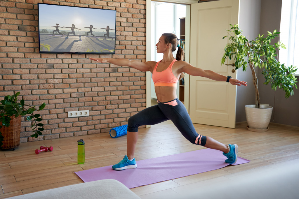 a woman doing a fitness routine at home