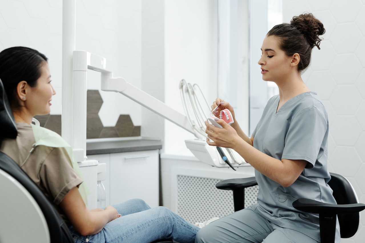 a dentist talking to her patient