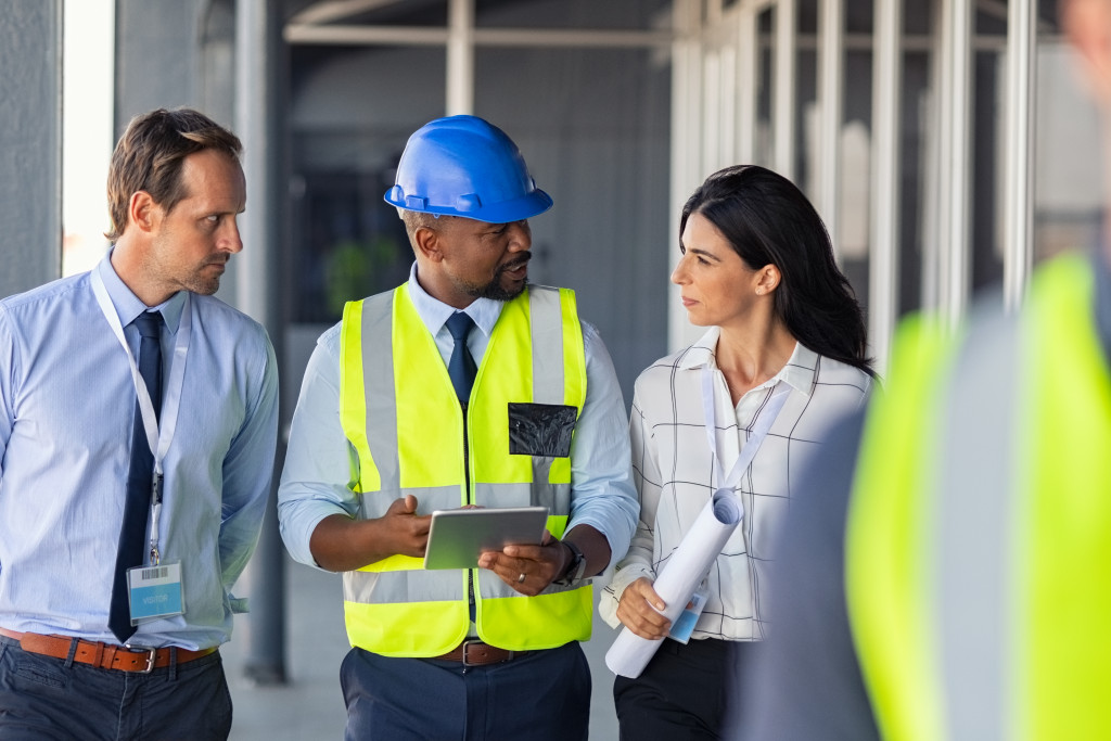 Construction professionals discussing on-site