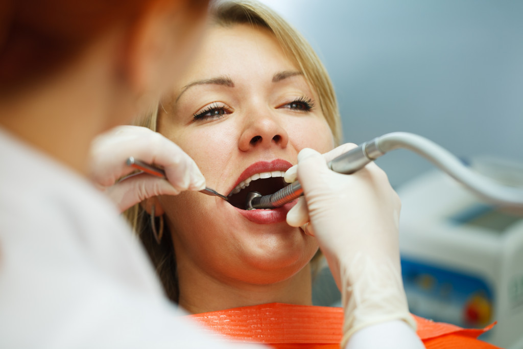 dentist performing dental checks