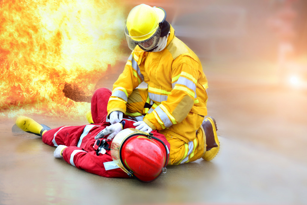 A fireman rescuing a colleague from a fire