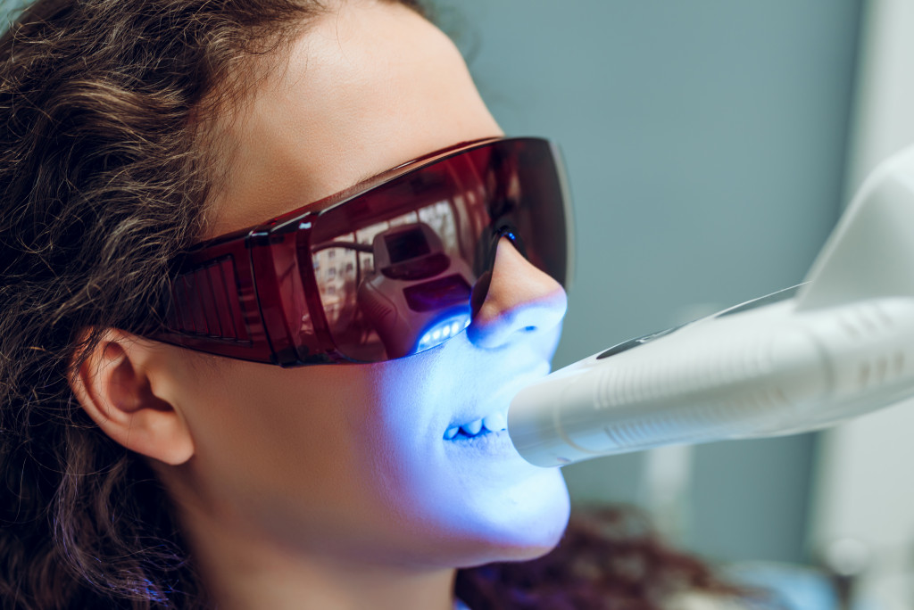 dental patient getting a laser dental treatment