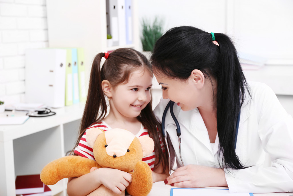 A kid with her pediatrician